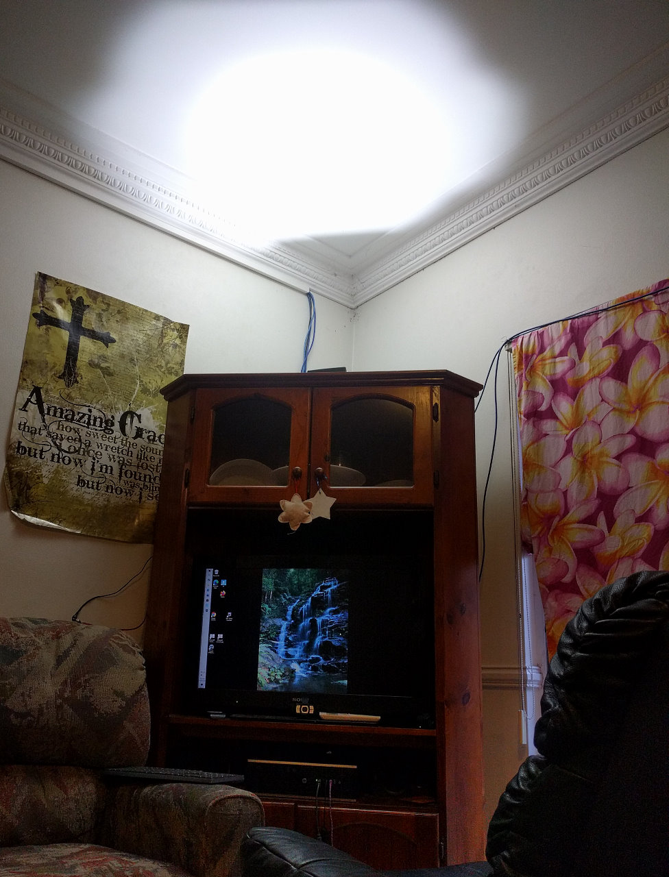 The floodlight is pointed at the ceiling, so the light difuses around the room.