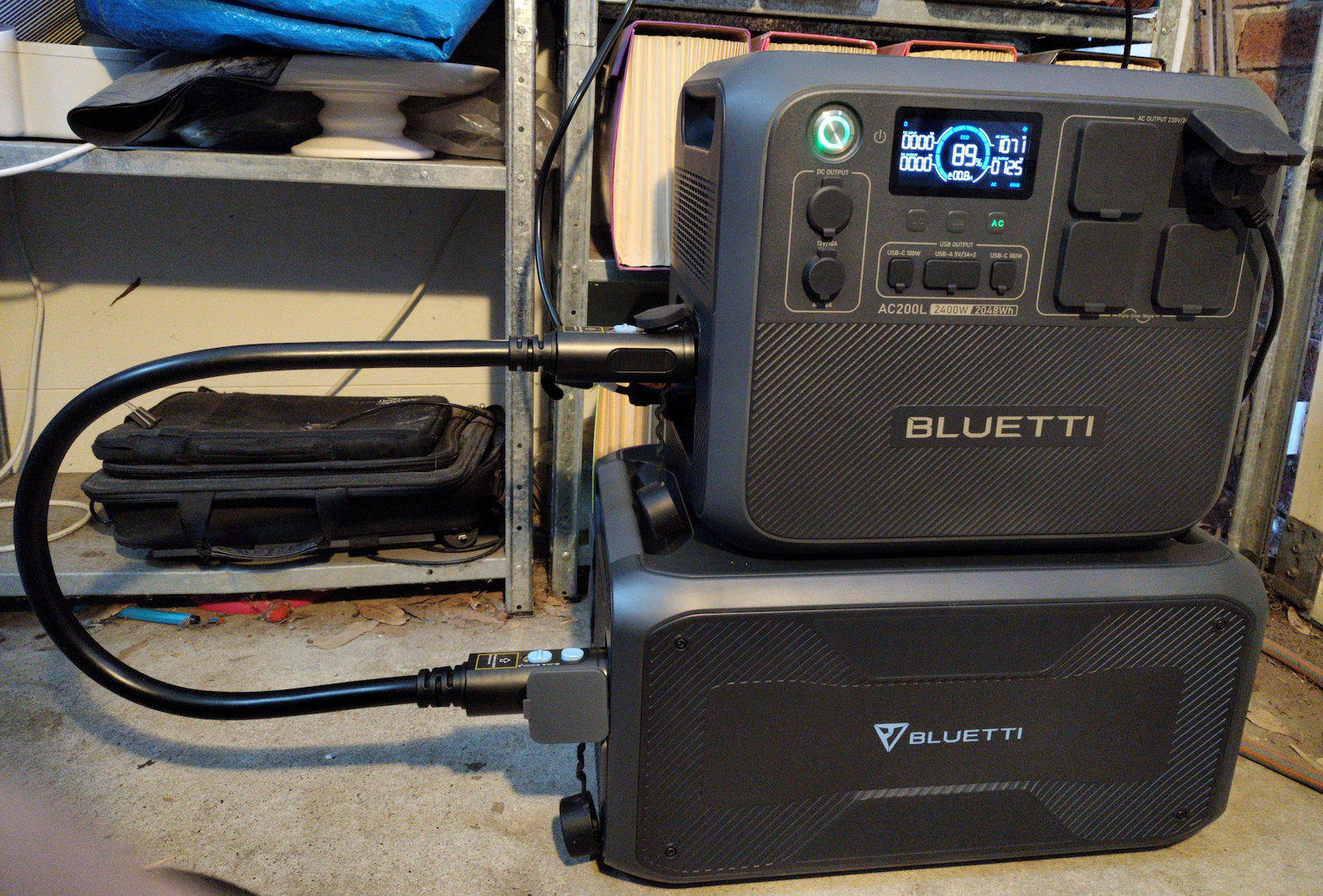 AC200L and B300 stacked on top of each other, powered on, charging and under test.