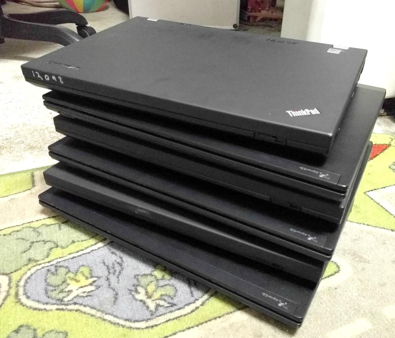 A stack of old laptops.